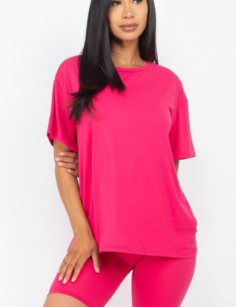 Women wearing pink 2pc set facing forward